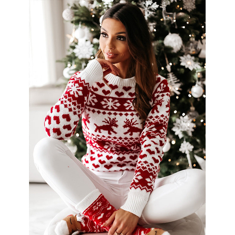 Damski sweter świąteczny z reniferem w zimowym wzorze