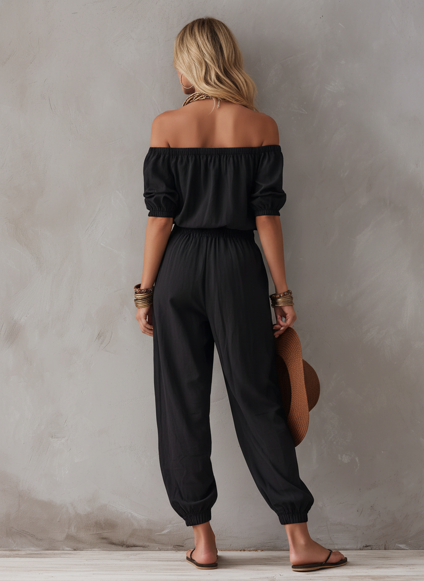 Czarny jumpsuit damski z odkrytymi ramionami, widok z przodu